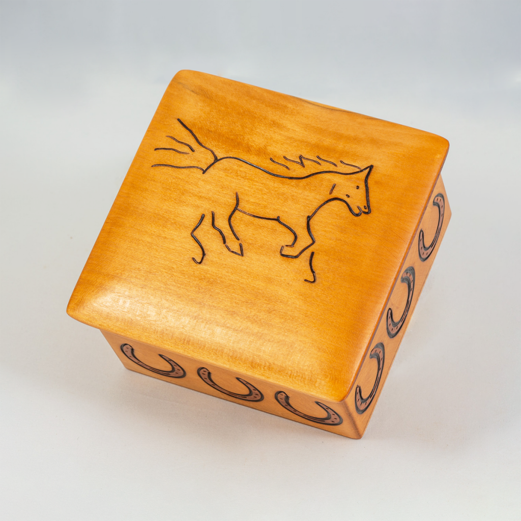 Small wooden equine urn.